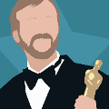 icomania:A man with a tan beard in a suit holding a Academy Award